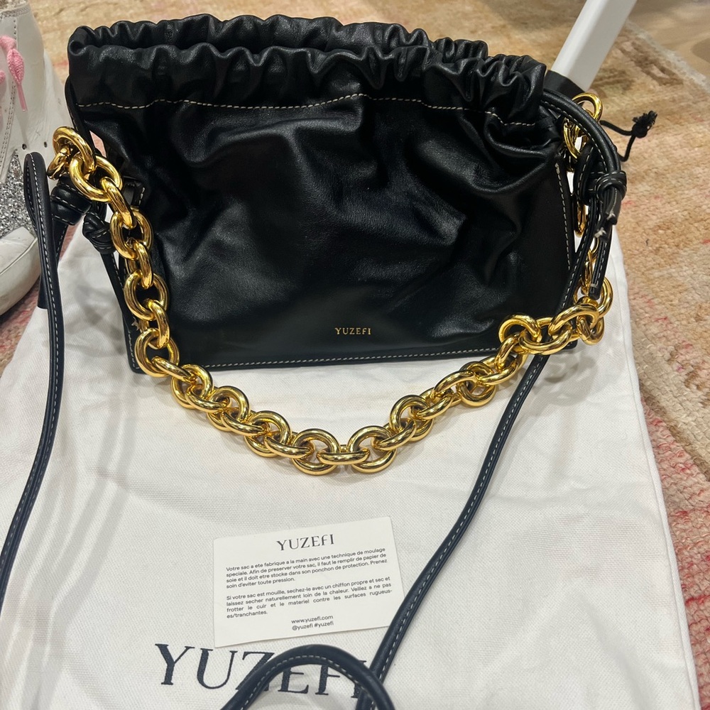 Yuzefi Black Bag with Gold Chain Accent